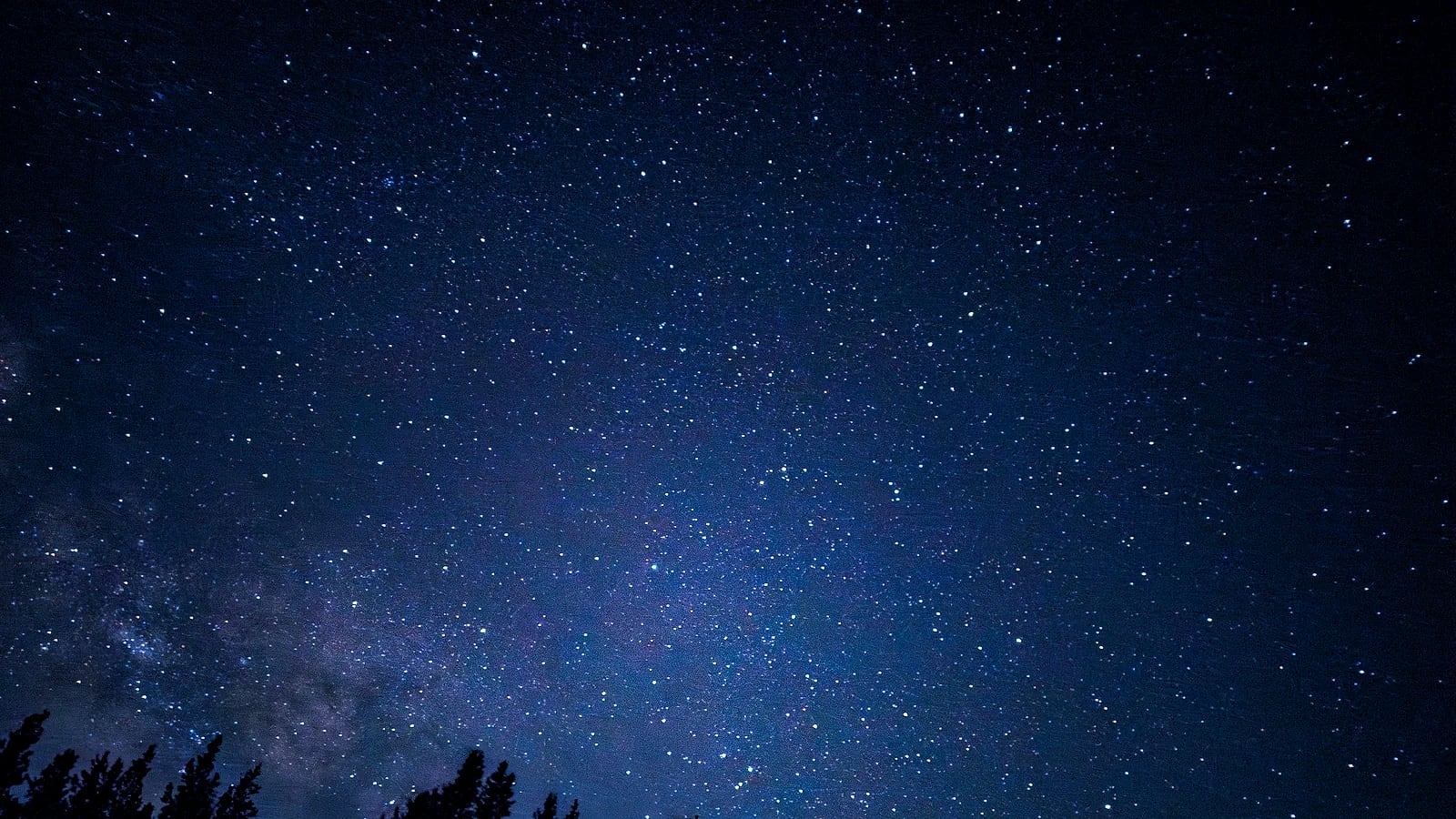 Dense stars and the bright Milky Way core in a natural blue-violet night sky